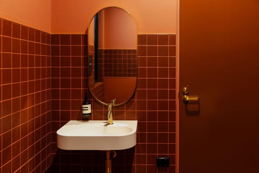 The Retreat Restaurant & Bar bathroom red tiles